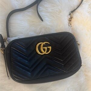 Black and gold Gucci purse.